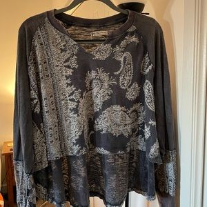 Free People Paisley tee size small. Never worn but tags removed. Grayish blue.
